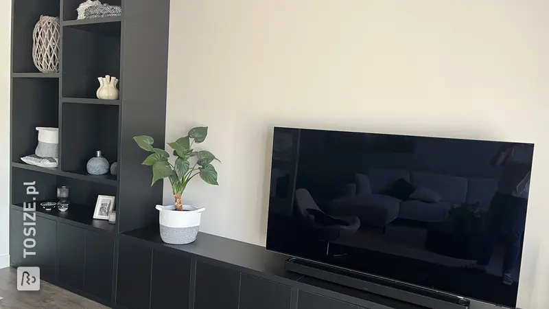 Stylish black wall unit for the living room, by Brenda