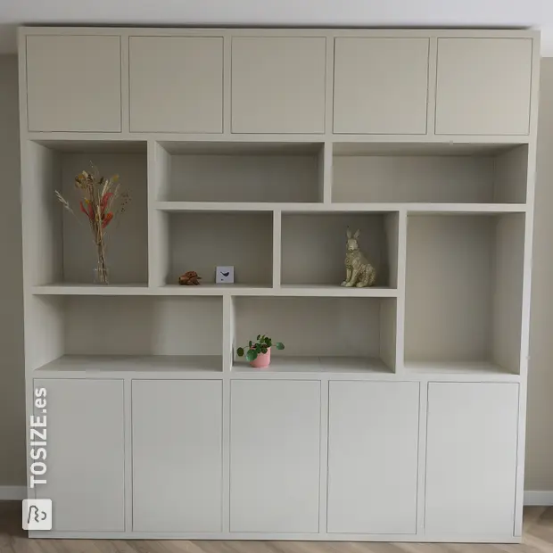 Cream cupboard wall with open compartments and doors