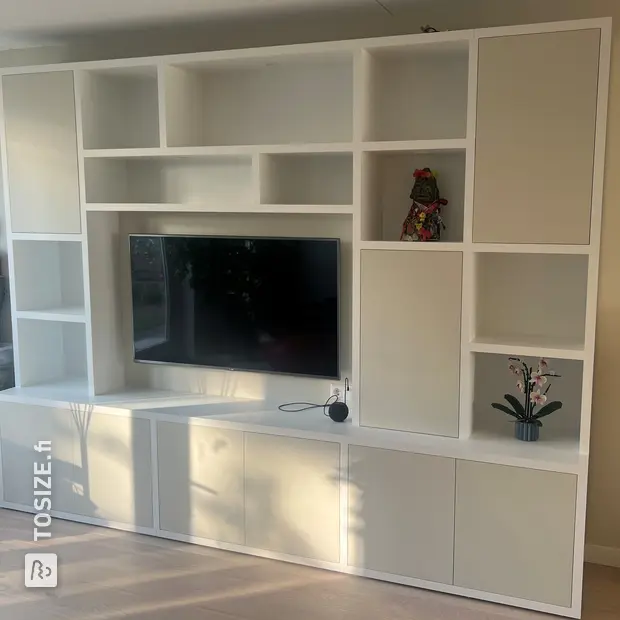 White cupboard wall with doors and open compartments