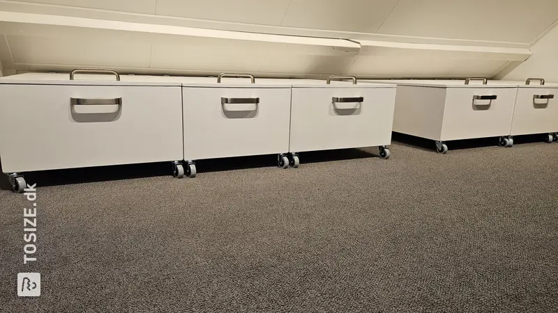 Rolling Storage Cabinets Under Low Wall, by Sijbrand