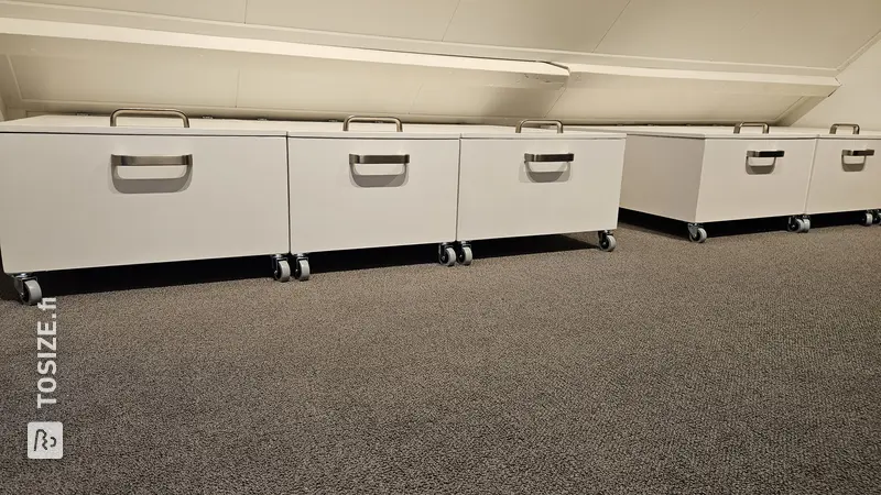 Rolling Storage Cabinets Under Low Wall, by Sijbrand