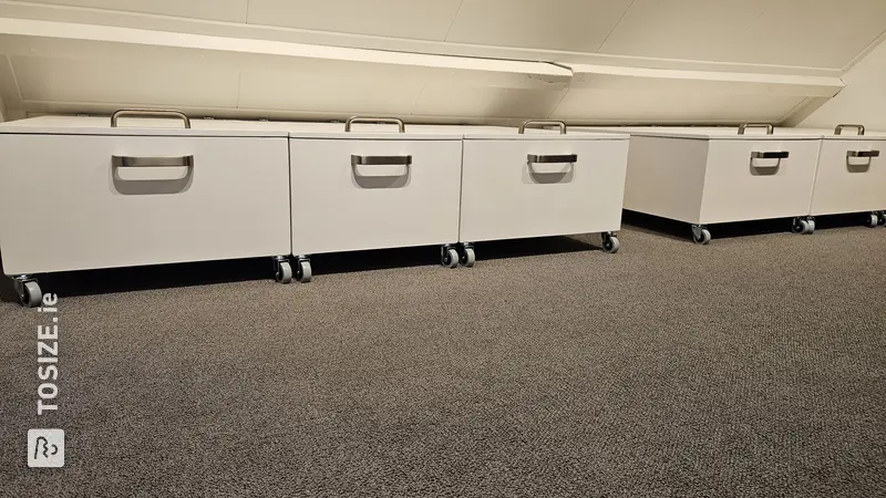 Rolling Storage Cabinets Under Low Wall, by Sijbrand