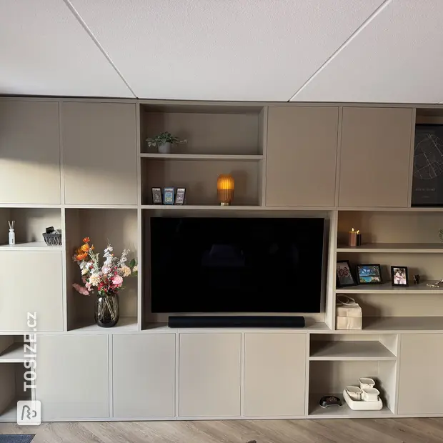 Cream cupboard wall with open compartments and doors