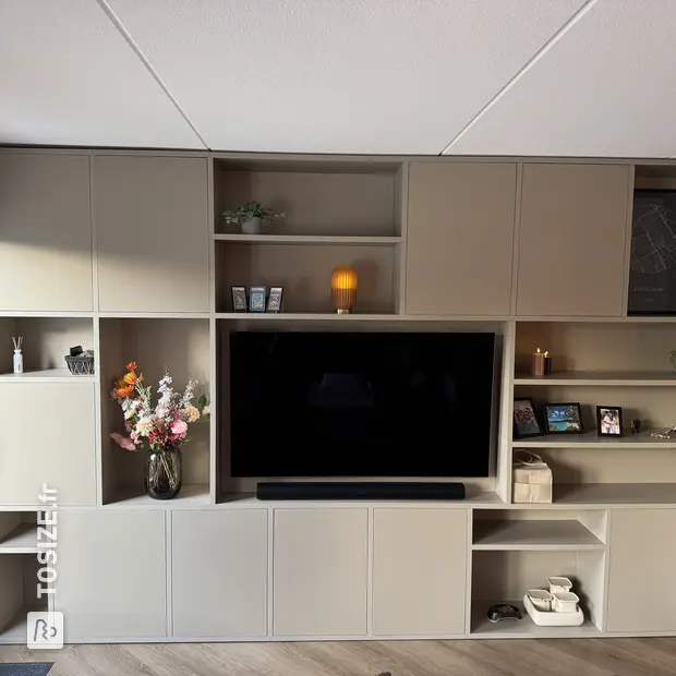 Cream cupboard wall with open compartments and doors