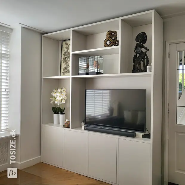 White cupboard wall with open compartments and doors