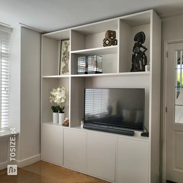 White cupboard wall with open compartments and doors
