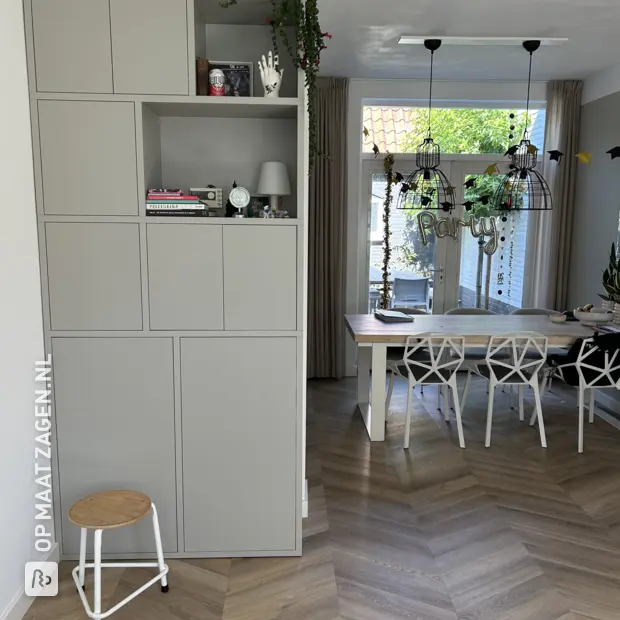 Gray cupboard wall with doors and open compartments