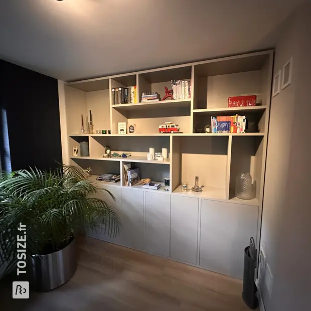 Gray cupboard wall with open compartments and doors