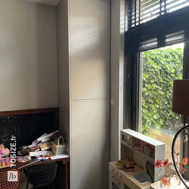 Gray cupboard wall with open compartments and doors