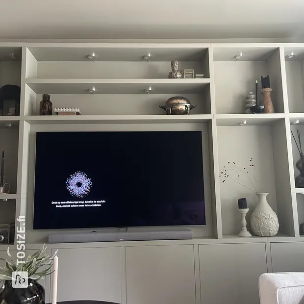 Light cabinet with open compartments and doors
