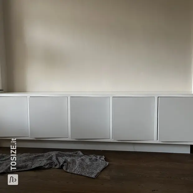 White sideboard with doors and open compartments
