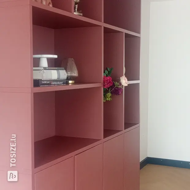 Red shelving unit with doors and open compartments