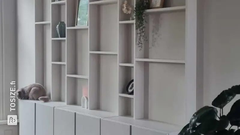 Custom made MDF shelving unit in the living room, by Sebastian