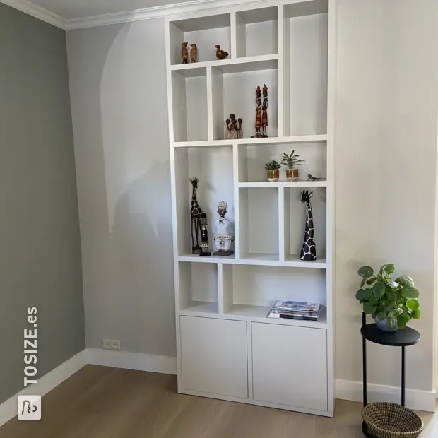 White shelving unit with open compartments and doors