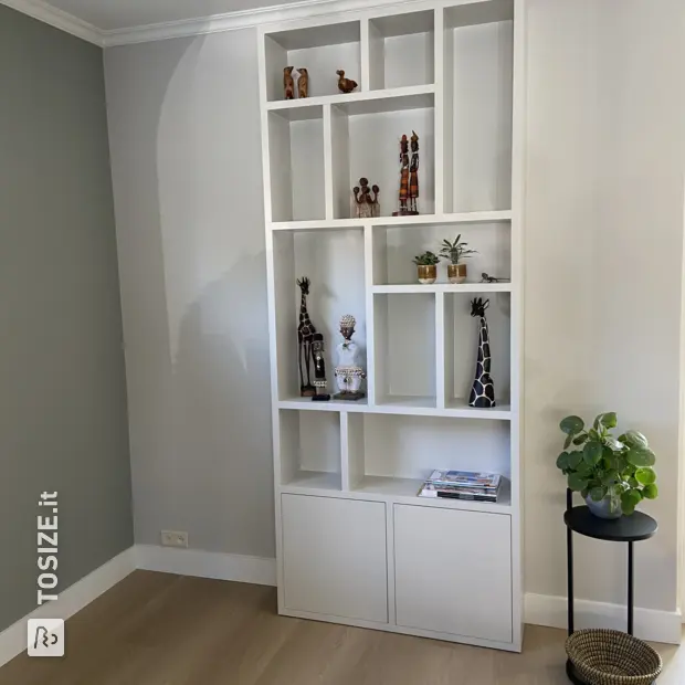White shelving unit with open compartments and doors
