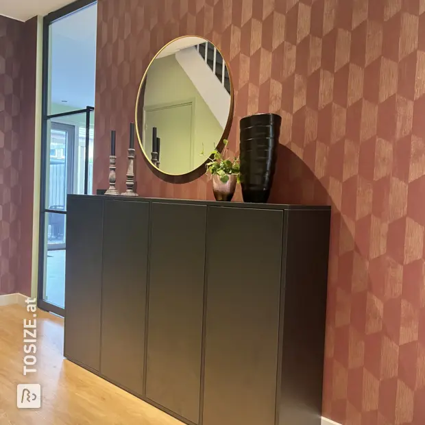 Black shoe cabinet with doors and open compartments