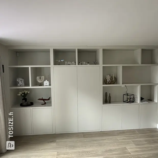 Gray cabinet with doors and open compartments