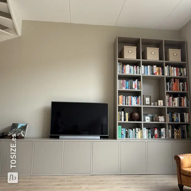 Gray cupboard wall with open compartments and doors