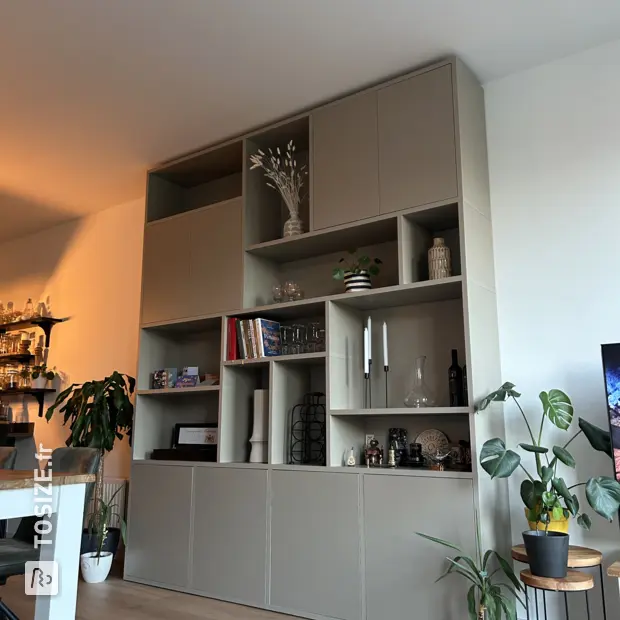 Gray cupboard wall with open compartments and doors