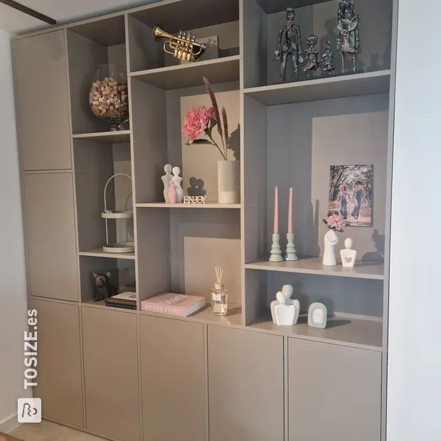 Gray cupboard wall with open compartments and doors