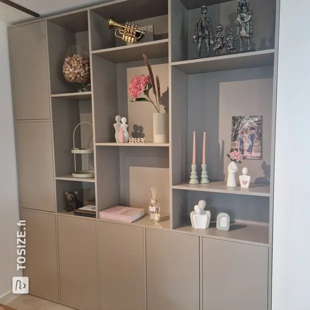 Gray cupboard wall with open compartments and doors