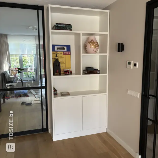 White cupboard wall with doors and open compartments