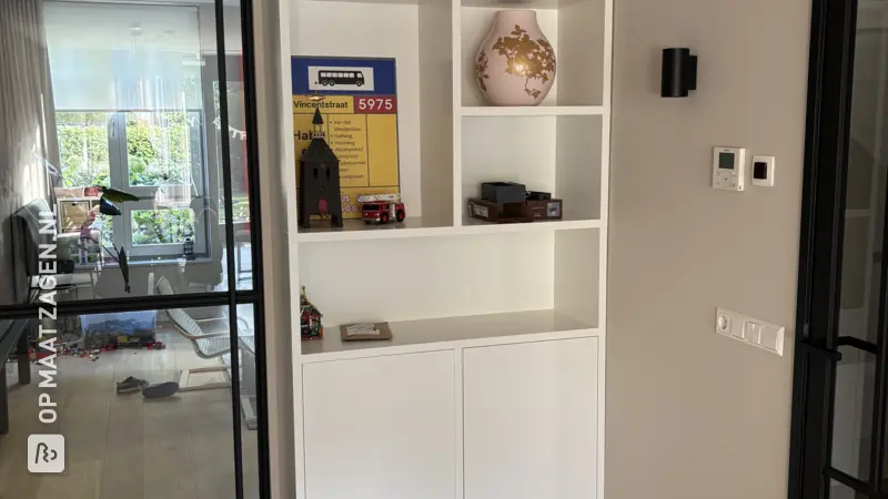 Stylish white wall cupboard for the living room, by Francien