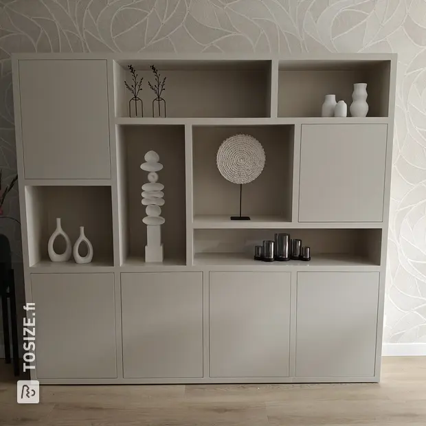 Cream cupboard wall with doors and open compartments
