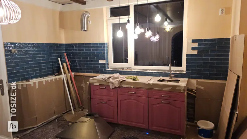 Unique kitchen renovation with wooden countertop and drawer fronts, by Vincent