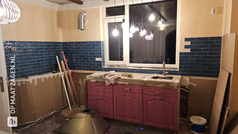 Unique kitchen renovation with wooden countertop and drawer fronts, by Vincent