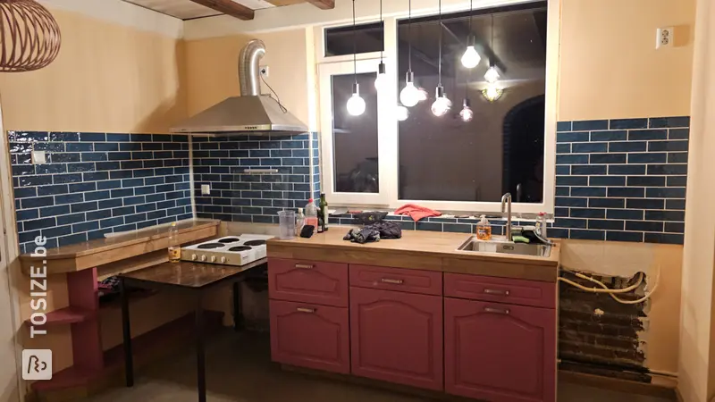 Unique kitchen renovation with wooden countertop and drawer fronts, by Vincent