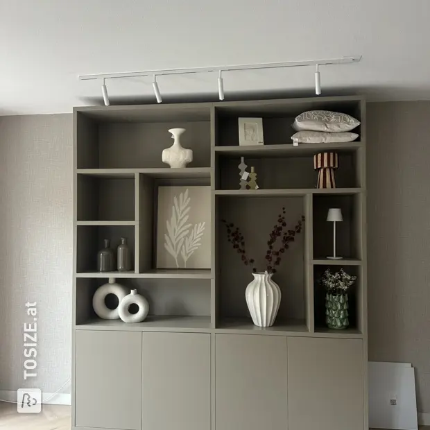 Gray cupboard wall with doors and open compartments