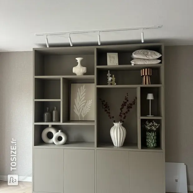Gray cupboard wall with doors and open compartments