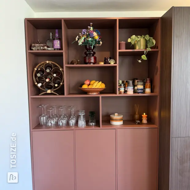 Brown cupboard wall with open compartments and doors