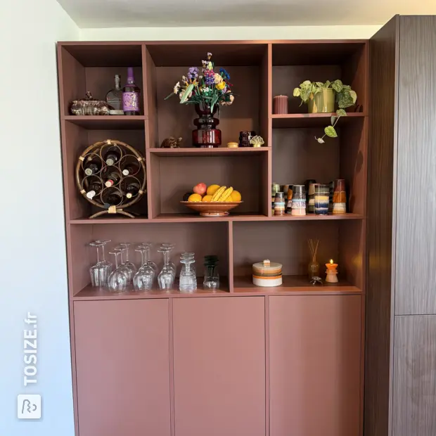 Brown cupboard wall with open compartments and doors