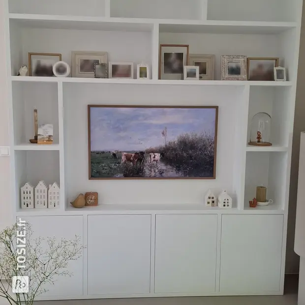 White cupboard wall with open compartments and doors