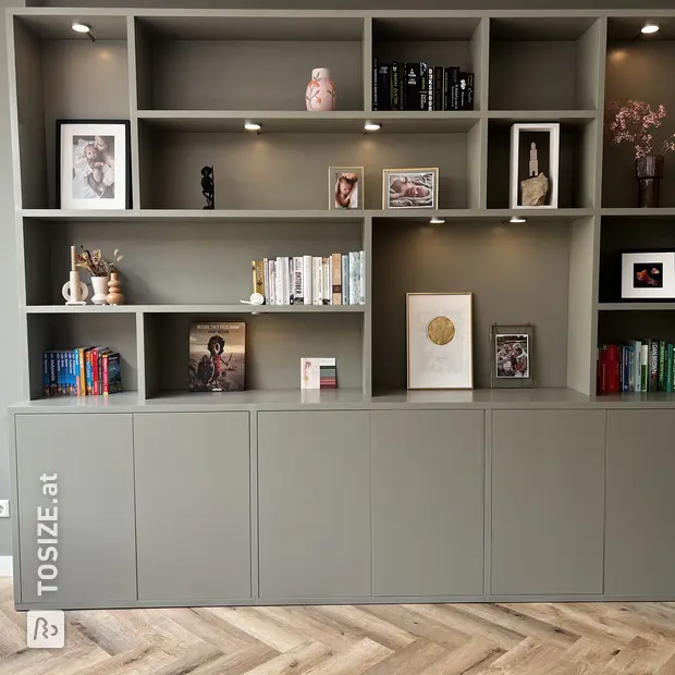 Gray cupboard wall with open compartments and doors