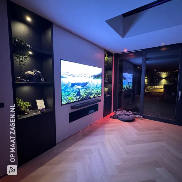Black cupboard wall with open compartments and doors