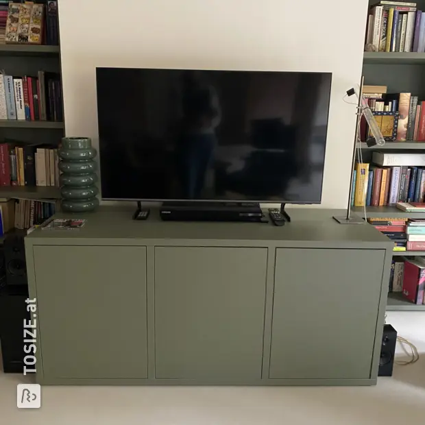 Green sideboard with doors and open compartments