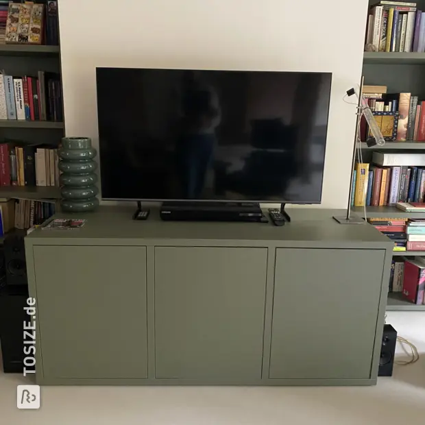 Green sideboard with doors and open compartments