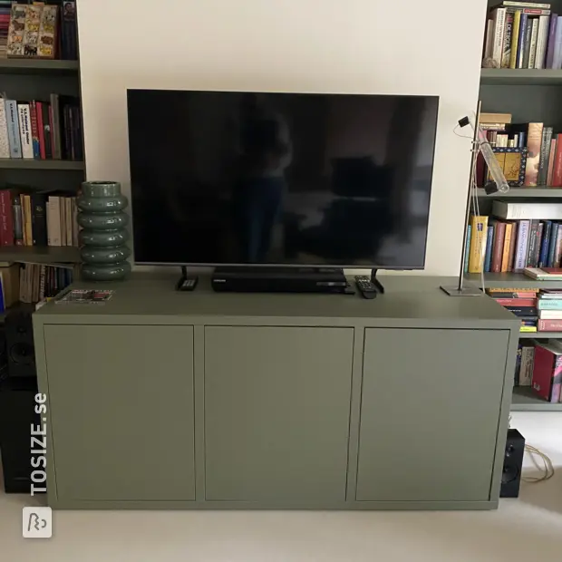 Green sideboard with doors and open compartments