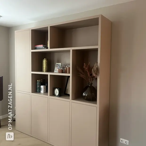 Beige cupboard wall with doors and open compartments