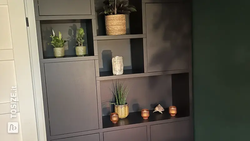 Homemade black-brown wall cabinet in the living room, by Cynthia