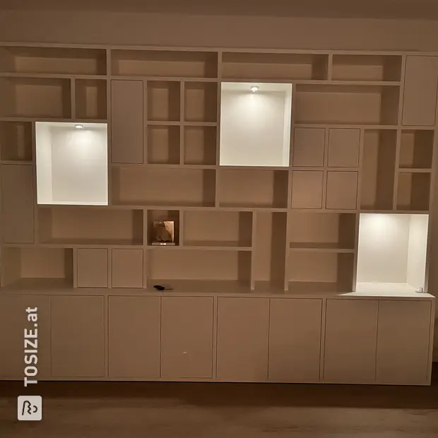White cabinet with doors and open compartments
