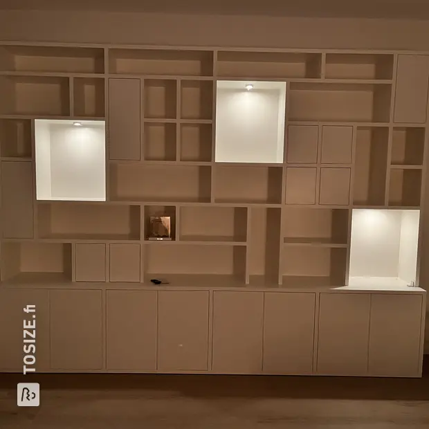 White cabinet with doors and open compartments