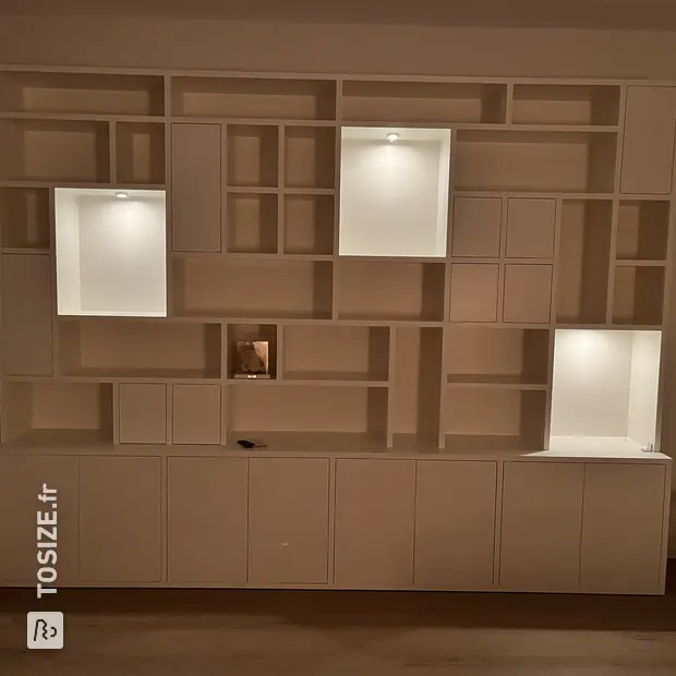 White cabinet with doors and open compartments