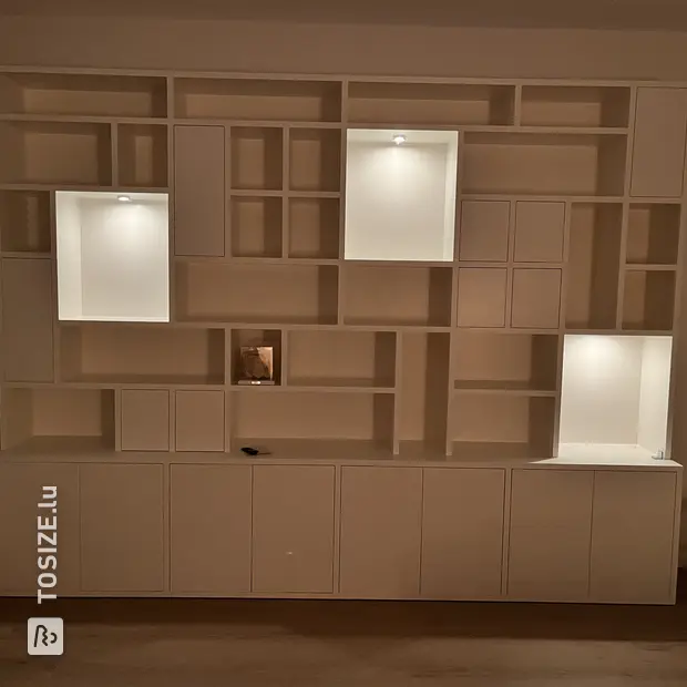 White cabinet with doors and open compartments