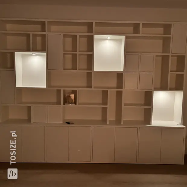 White cabinet with doors and open compartments