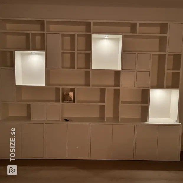 White cabinet with doors and open compartments