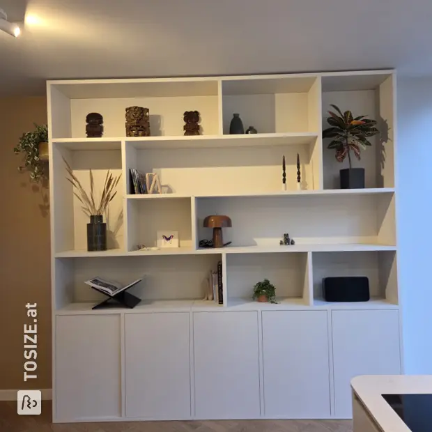 White cupboard wall with open compartments and doors